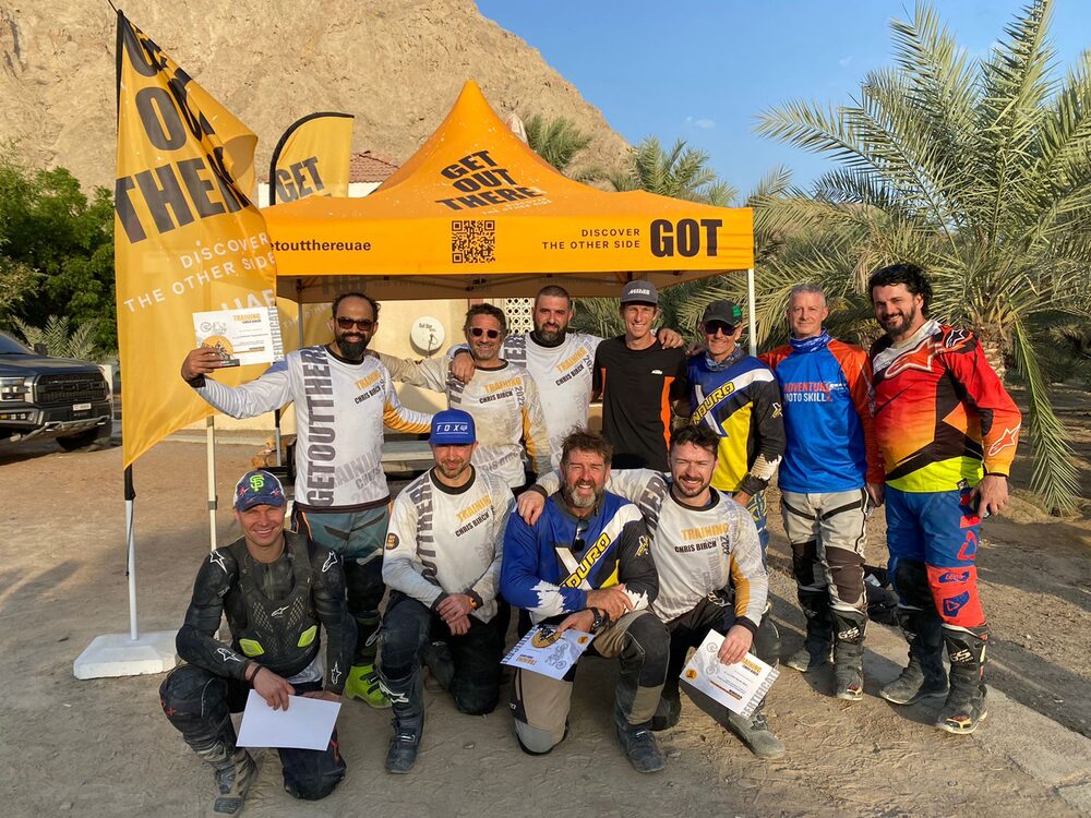 Group of riders at a Chris Birch training session under the Get Out There tent