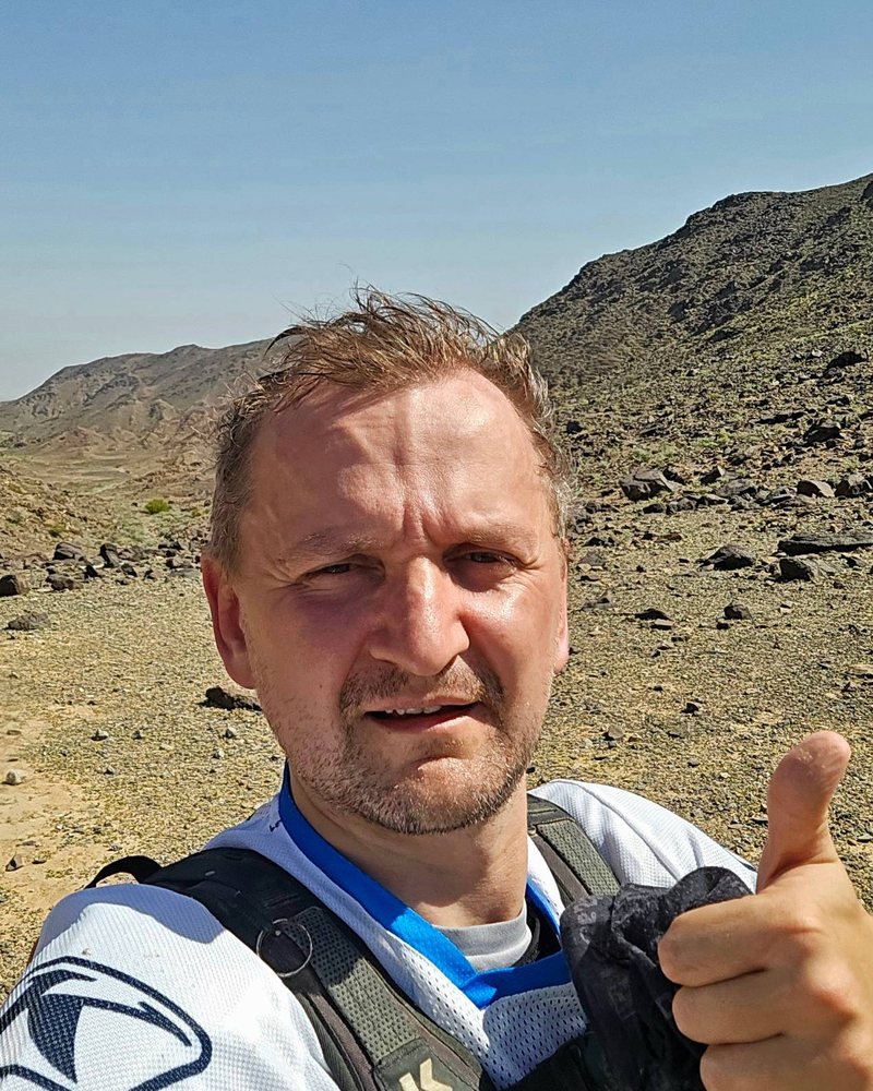 Sergii giving a thumbs up in a rocky wadi